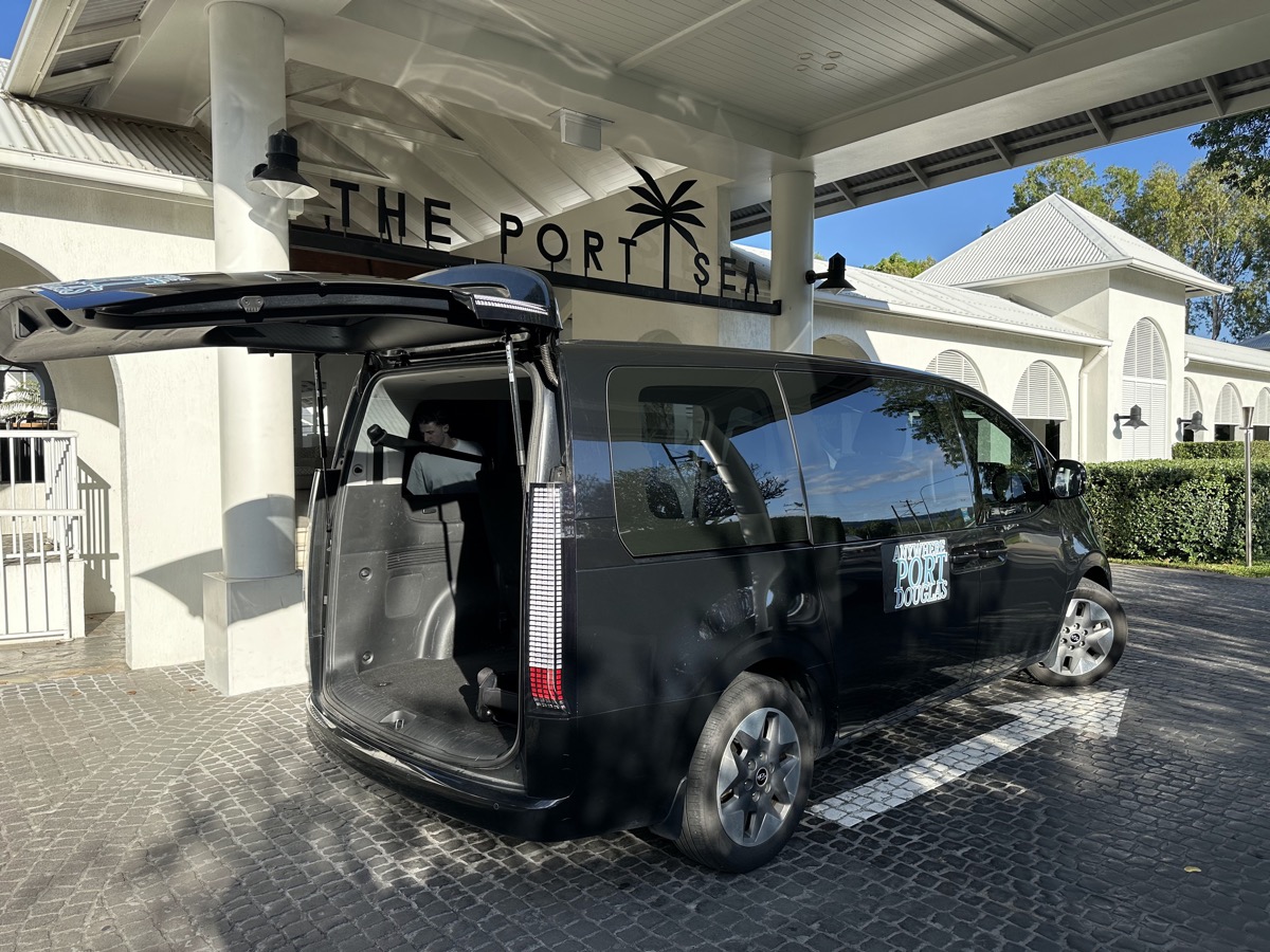 Minibus group transfer drop-off at Port Douglas hotel